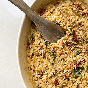 Boursin Spinach and Sundried Tomato Orzo Bake | Paperny Family JCC
